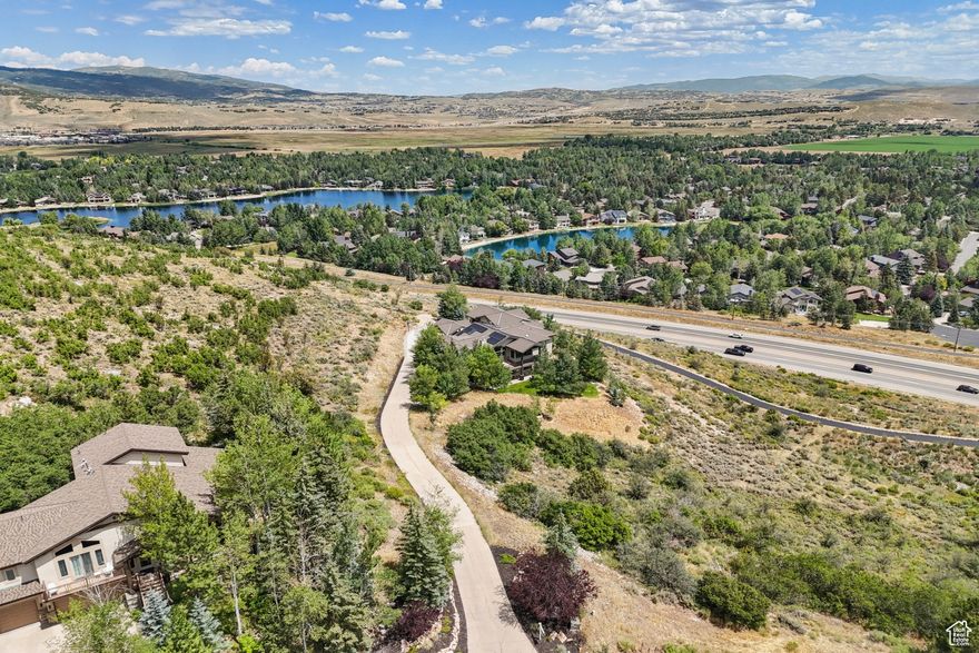 Located just a mile from the Canyons base at Park City, this spacious Sun Peak home offers the perfect blend of mountain living and modern comfort. Enjoy stunning ski mountain views, even from the hot tub, ample space for everyone featuring six bedrooms, each with its own en suite bathroom. Recent updates include new flooring and fresh paint throughout, there's still room for improving the kitchen with removal of a wall and adding a new kitchen island. The main-level primary suite and oversized kitchen make everyday living a breeze, while solar panels and a Tesla Powerwall add energy efficiency. Cozy up to both gas and wood-burning fireplaces, and entertain in style in the expansive media and gathering room. The oversized heated garage spans over 1,300 sq. ft. with epoxy floors, floor drains, and built-in storage. Neighborhood amenities include a clubhouse, tennis courts, and a seasonal outdoor salt water pool. Located very close to ski resorts, trails, parks, schools, and the bike path. Square footage per appraiser; buyer to verify.