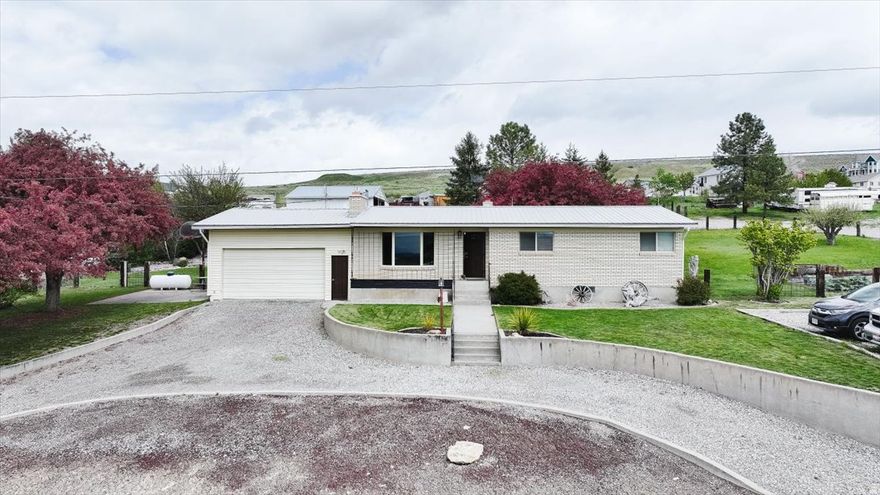 Discover the charm of Idaho countryside living with this beautifully situated 4-bedroom home, 2.5 bathroom home nestled along the scenic Cub River Road in historic Franklin. Offering approximately 2,700 sq ft of thoughtfully designed living space. This property delivers the perfect blend of comfort, functionality, and tranquility.   The backyard features an updated deck, a covered dining patio, and a sprawling, fully fenced backyard. Complete with garden space and a mature shade-providing crabapple tree. it's the ideal setting for relaxing, entertaining and playtime.  Past the yard, you can walk to or drive to an expansive outbuilding with plenty of square footage to comfortably park your recreational vehicles or create a dedicated area for a shop offering the perfect, spacious set up for mechanics, woodworkers, or anyone needing a serious workspace. Beyond the workshop, the back section of the acreage is securely fenced off, providing a safe, and closed environment that is absolutely perfect for a couple of horses or small farm animals.  Lovely horse property, shop, fenced in field and backyard. BBQ Patio. 4 bedrooms and 2.5 baths. Coveted Cub River Views. Easy access to trail heads for nature sports. Easy access to Logan. Garden plot. Firepit.