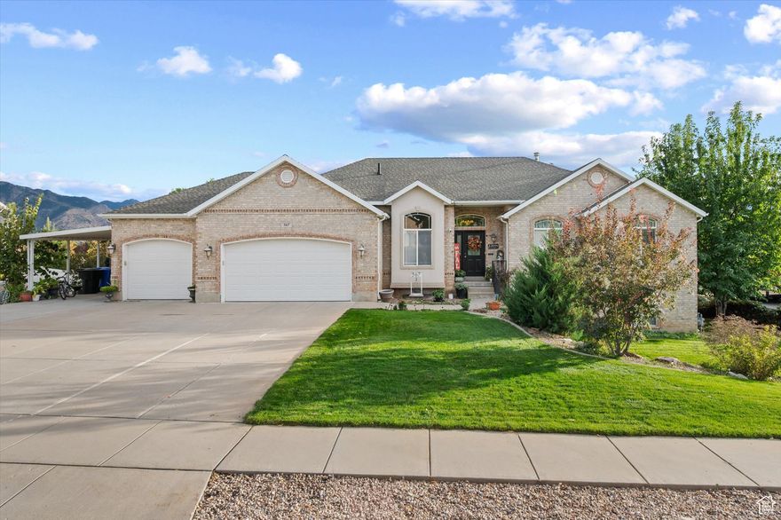 Location, Location, Location!  This home truly has it all-the perfect setting, thoughtful updates, and a beautifully landscaped yard. Enjoy a flat driveway with plenty of parking in addition to a spacious 3-car garage. Step into the backyard retreat, where you can gather around the fire pit on cool evenings, or imagine summer fun on the covered deck, covered patio, and lanai area.  Inside, you'll find an updated kitchen, new LVP flooring and carpet, oversized bedrooms, and two family rooms-perfect for everyday living and entertaining. The basement entrance with rough plumbing provides the option to add a kitchen for an apartment, ADU, or future mother-in-law suite.  From fall's colorful views to breathtaking winter vistas of Ben Lomond, and even the best seat in town for the Founder's Day fireworks-this home is a must-see!