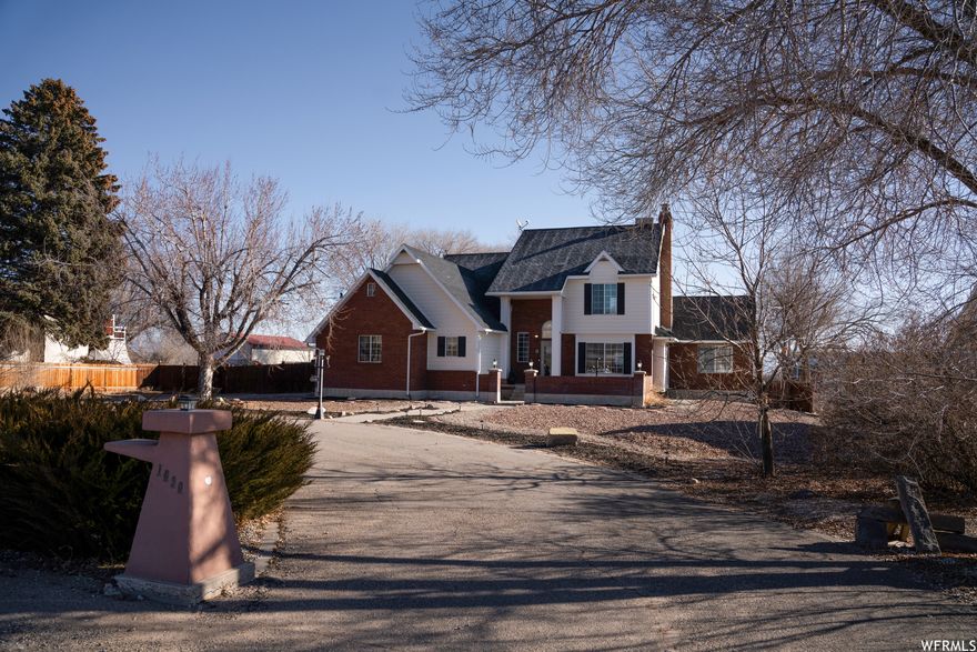 Beautiful move in ready 4-bedroom, 3.5-bathroom home on 2 acres with 2 car garage in Maeser! 4,278 Square foot home includes 3 living rooms, wood burning stove, pellet stove, office, cold storage, firewood storage room, and 2 additional storage rooms! Large open kitchen with lots of natural light. Oversized primary bedroom with incredible closet/dressing room, dual vanity, jetted tub, and separate shower! Enjoy the deck with views of Split Mountain! Property is fenced and water shares included. Recent updates include roof, carpet, paint, smart water shut off, and water heater! Square foot per previous listing. Natural gas is on the property and just needs to be brought into the home. Buyer to verify all information including square foot.