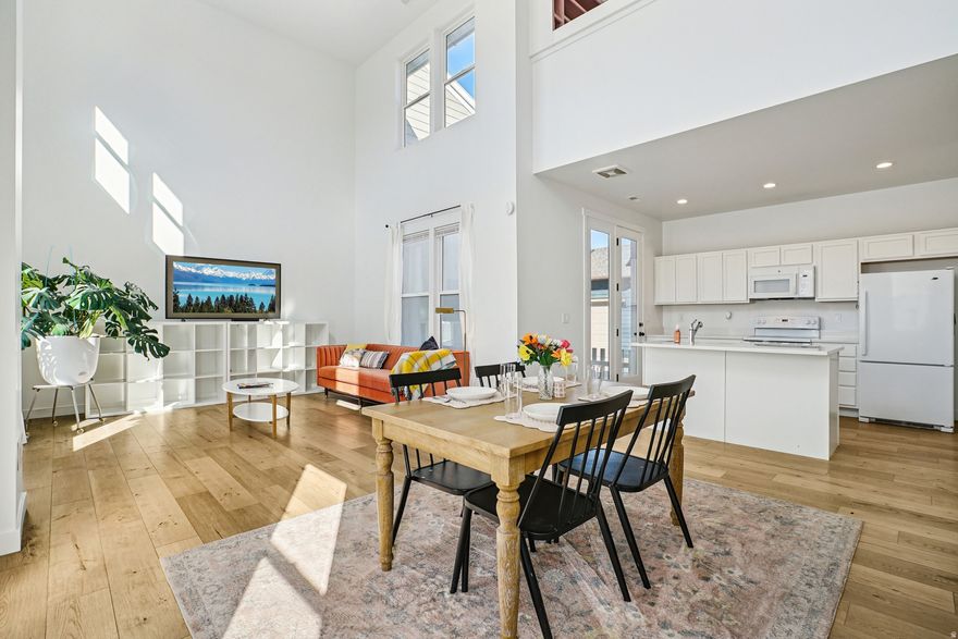 Bright and inviting 2-story townhouse in the heart of Daybreak! Light-filled main floor with soaring ceilings and an open feel, plus a spacious second-floor loft with built-in bookshelves overlooking the living area. Two bedrooms, 2.5 baths, and walk-in closets in both bedrooms. New carpet on the second floor with durable LVP throughout the main. Under-stair storage and optional dining storage included. Fully landscaped and maintained by the HOA with access to pools, gyms, walking trails, pickleball and tennis. Fun, vibrant location near the ballpark, restaurants, and movie theater.