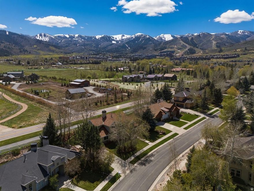 This thoughtfully designed home in the highly sought-after Snyder's Mill neighborhood offers 2,648 square feet of well-planned living. Set on a level homesite, the property enjoys views toward Park City Mountain Resort and Canyons Village, adding to the everyday appeal of its Park City setting. With four bedrooms, three bathrooms, and an open, intentional layout, the home balances comfort, function, and warmth throughout. The main level is filled with natural light and features vaulted ceilings and rich hickory wood floors that bring texture and character to the living spaces. The kitchen is designed for both daily living and entertaining, with a gas cooktop, wall oven, generous prep space, and a spacious walk in pantry. Dining and living areas connect easily, while the gas fireplace creates a welcoming focal point for relaxed evenings at home. A dedicated office on the main level provides flexible space for work or creativity. A powder room and an attached two-car garage add everyday convenience.  Upstairs, the primary suite offers a private retreat with an ensuite bath featuring dual vanities, a soaking tub, shower, and custom walk in closet. Additional bedrooms are finished with custom closets, and the secondary bathroom includes double vanities and linen storage.  Outdoor living is equally inviting, with a back patio that opens to mountain views and offers a front row seat to seasonal fireworks at Canyons Village. The landscaped yard creates a peaceful setting for dining, relaxing, and enjoying the outdoors throughout the year.  Ideally located in the Park City School District and just minutes from world class skiing, trail systems, dining, and daily conveniences, this home presents a rare opportunity to enjoy mountain living with ease, access, and lasting appeal.