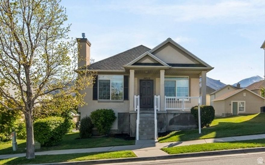 This beautifully updated Draper rambler offers the perfect blend of comfort and style. This 6-bedroom home has been tastefully updated with a gas fireplace and fresh, neutral finishes throughout. The spacious layout offers a luxurious primary suite featuring a new vanity and walk-in closet.  The newly finished basement is thoughtfully designed with a full kitchen, quartz countertops, second laundry space, daylight windows, and a walkout entrance-perfect for entertaining or multi-generational living. A two-car garage plus an extended parking pad offers space for up to six vehicles. With the major mechanical systems and the roof already updated, this home is move-in ready and built for easy living. Ideally located near endless hiking and biking trails, you'll love the access to everything that makes Draper such a premier place to live-plus it's just minutes from the Draper Rec Center and close to a nearby elementary school.