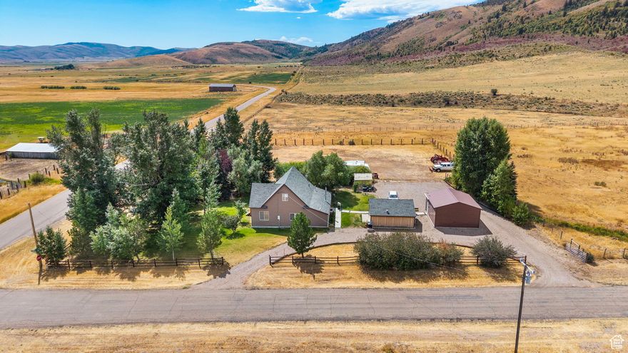 This property sits right at the mouth of Skinner Canyon, giving you direct access to miles of trails and mountain country just outside your door. The home is on 1.47 acres with a year-round ditch running through, so there's water on the land and room to keep horses or other animals. The house itself offers 3 bedrooms along with a bonus room that could easily work as a fourth. There's one bathroom in place now, but the layout makes it possible to add a master bath if you'd like down the road. A greenhouse and a couple of shops (both heated) are already set up, adding some real utility for anyone who likes to grow, build, or store gear. What stands out here is the setting. From the front deck you're looking at mountain views with very little traffic around, so the property keeps that quiet country feel people come to Nounan for. It's a place where you can step outside, hear the water running through the ditch, and be on a canyon trail within minutes.