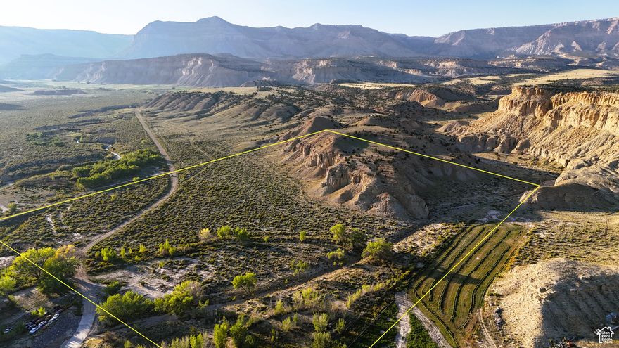 40+ acres of recreational property located less than a mile off of HWY 10 and less than 5 miles from Emery. Located at the intersection of Quitchumpah Creek and Link Canyon Wash, the property has a little bit of everything to complement the panoramic views. The creek bottom gives way to scattered trees and mature brush, which covers the majority of the property before it rises dramatically with 100+ foot cliffs supporting a flat mesa with overlooks in every direction.   The canyon has a dead-end road, ensuring that traffic in the area is minimal and the serenity offered by nature is unbroken. With year-round water in the creek and agriculture nearby, this lot serves as a corridor for various wildlife, including deer, turkeys, foxes, and coyotes, along with several other species. To the north, Link Canyon, the Wasatch Plateau, and Wildcat Knolls make for a picture-perfect backdrop. To the west, Convulsion Canyon and Water Hollow combine for more awe-inspiring views. Finally, above the fields to the south, the rocky canyons of the San Rafael Swell are visible.   A recent development, the property now has 4.73 ACFT of underground water rights supporting a home, stock watering, and irrigation. If you are looking for room and water for your animals, start a hobby farm, or to live off-grid, then this place would be ideal. The property has been recently surveyed, saving the new owners nearly $2500, and the mineral rights are also conveyed with the property. Power is on the property as well as telecommunications, and the buyer would need to check for hookup expenses/fees.   This lot is located close to Fish Lake National Forest, the San Rafael Swell, and well over 3 million acres of public land for your family to explore. If you are looking for a legacy-type family retreat property that will be enjoyed for many years, this is the lot for you!