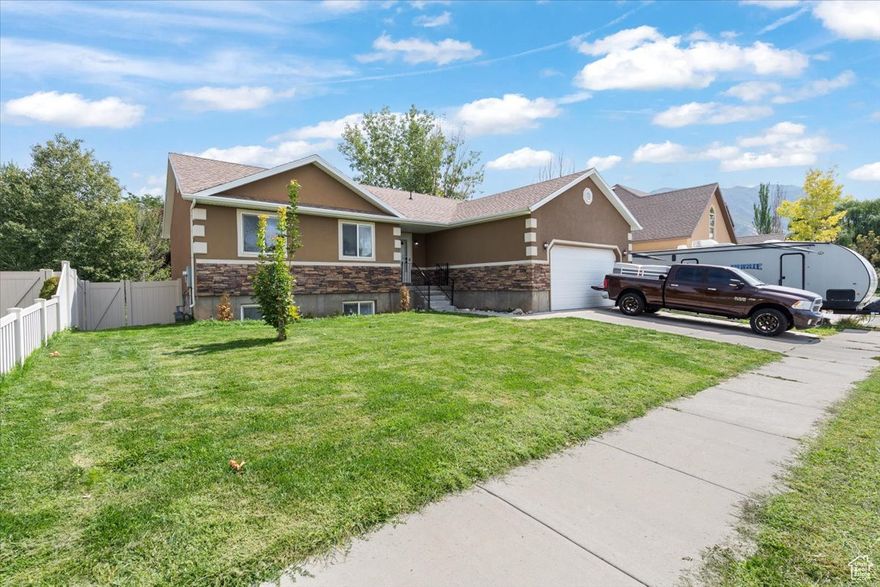 Tucked away in a cul-de-sac and right next to a community park, this home is the perfect blend of comfort and convenience. Just minutes from Walmart, freeway access, shopping, and dining-you'll love the easy lifestyle this location provides! Step inside to discover a newly finished basement offering plenty of open gathering spaces-perfect for family movie nights, game time, or hosting guests. The main floor features 3 bedrooms and 2 bathrooms, while the basement adds an additional bedroom and  bath, giving you flexibility for visitors, or a home office. Enjoy a fully fenced backyard and low-maintenance landscaping with sprinkler. Whether you're looking for room to grow, a great place to entertain, or simply a welcoming neighborhood, this home checks all the boxes.