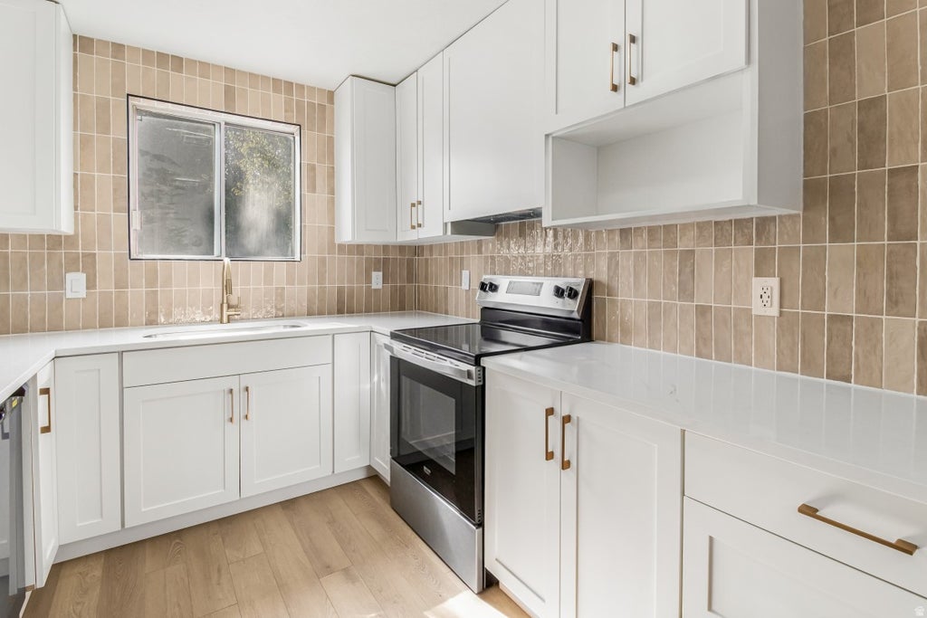 Photo of 5504 W TICKLEGRASS RD S, West Jordan, UT 84081 (MLS # 2176552)