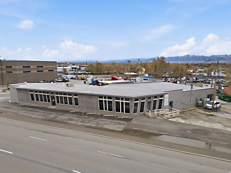 PROPERTY FEATURES   Building Square Footage: 9000 SF with a break down of space: Office space (820 Sq Ft), showroom space(2551 Sq Ft), Shop (2208 Sq Ft) Warehouse: Approx. 3421 SF  Lot size: 0.50 Acres including secure yard space and customer parking. 4- 10x10 Doors. Each door provides access to the following spaces: Warehouse, front showroom, shop and access for locked yard to shop. Clear Height: 12'  Parking: 12 Spaces off Beck Street  Heating: Office, currently heated with mini-split systems  Updated smart lighting, smart locks, and security system that tracks people and movement and vehicles with counting capability. Hot water heater replaced in 2024. Roof replaced prior to current owner taking possession approx. 2020, flashing done in 2022 from previous owner. Painting of building done approx. 2023 with insulated garage doors. New pavement done 2023 in front of building Current count of traffic per UDOTs website is 23770 per day. Property located right along Beck St for excellent visibility of vehicle traffic  Construction Type: Block  Walk in Safe: 13" Concrete Walls  Year Built: 1952  Zoning: M1  Location: Located near Salt Lake Central Station Commuter Rail  Access: Great Access to I-15 with Multiple Exits. Buyer to verify all information, provided as a courtesy.