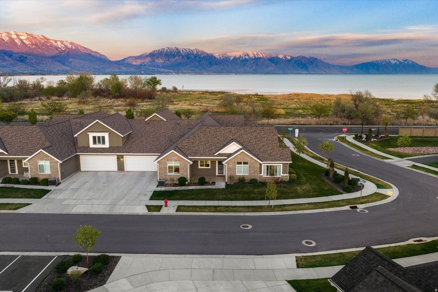 Welcome to the 55+ retreat you've been waiting for in the Villas At Legacy Farms! This rare lake view lot, is a premier location. Beautiful immaculate 3-bedroom, 2-bath ranch-style patio home has unobstructed views of Utah Lake. Inside and out, the seller spared no expense on premium upgrades to create a truly maintenance-free sanctuary. Designed for comfort and style, this home features a seamless "no-step" entry and an expansive open-concept kitchen boasting quartz countertops and vaulted ceilings. Modern conveniences abound, including remote-controlled shades, a Blink security system, and an IGen 45 Defender by NuWater water softener and filtration system. The primary suite offers a spa-like experience with upgraded 35-inch vanities and a custom walk-in shower by Re-Bath. Car enthusiasts and hobbyists will love the extra-length garage, providing the rare space needed for longer vehicles or a dedicated workshop area. It comes fully equipped with custom overhead pulley system storage racks, maximizing every inch of storage while keeping your floor space clear and organized. Relax on your private, maintenance-free patio featuring a custom cover and sunscreen-the perfect vantage point for those incredible lake views. Living here means resort-style access to pickleball courts, Saratoga Hot Springs, and the Jordan River Parkway trailhead right across the street. Golfers are less than a mile from the par-72 championship links at Talons Cove, while the shopping at Traverse Mountain and the cultural hub of Thanksgiving Point are just minutes away. This isn't just a home-it's the lifestyle you've earned. 2D floorplans in photo section and 3D walkthrough available at our property website at:  https://justpendedutah.hd.pics/476-S-Iron-Shoe-Ln/idx