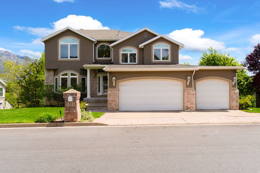 **OPEN HOUSE SAT. (5/23) 11 AM-1 PM** Homes like this are truly hard to find! Nestled in desirable East Layton, this exceptional estate offers breathtaking views of both the Wasatch Mountains and the valley. From the expansive rear deck spanning the length of the home, you can enjoy unforgettable evenings entertain guests, or simply relax while taking in the scenery. Proudly owned and meticulously maintained by the original owner, this home showcases quality and care throughout. The gourmet kitchen is a chef's dream featuring high-end stainless steel appliances, granite countertops, a large center island, abundant cabinetry, and generous prep space. Just off the kitchen, the spacious great room with fireplace creates the perfect gathering place for family and friends. Recent upgrades include new mechanical systems, permanent holiday, lighting, new windows, newer flooring, paint, and updated lighting, giving the home a fresh and modern feel. The functional floor plan offers elegant formal living and dining spaces, including a large sitting room ideal for a grand piano or additional entertaining area. Upstairs, an open walkway overlooks the grand entryway below, creating a bright and open atmosphere. The private owner's suite is set on its own level just above the secondary bedrooms and laundry room, offering a true retreat complete with vaulted ceilings, a two-sided fireplace, separate tub and shower, and a spacious walk-in closet. The fully finished basement features impressive 10-foot ceilings, a private kitchenette, separate entrance, two additional bedrooms, and a full bathroom-perfect for guests, multi-generational living, or adult children. Step outside to the covered patio where you can unwind in your future hot tub while enjoying mountain views and the peaceful surroundings. The park-like backyard provides your own private sanctuary, and the detached storage garage offers ideal space for lawn equipment, tools, and extra storage. Located on a quiet street just off Highway 193, this home offers quick freeway access, nearby foothill recreation, and dedicated community walking trails leading directly to Hobbs Pond. You are centrally located 20 minutes to downtown Salt Lake, or 20 minutes to Snowbasin ski resort. This is a rare opportunity to own a beautifully cared-for home in one of Layton's most sought-after locations. You will not want to miss this one!