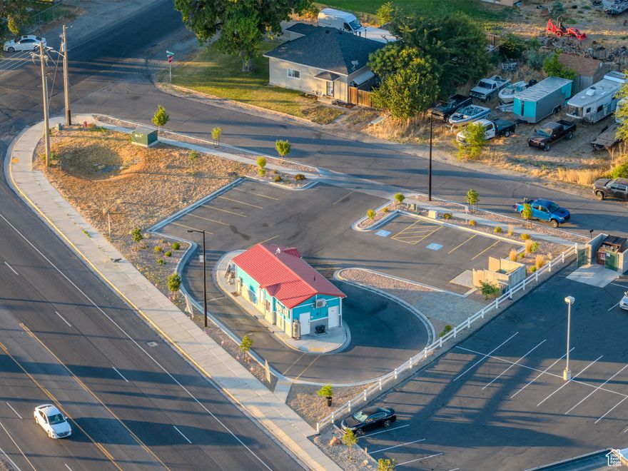 For Sale: Prime Commercial Drive-Thru Lot in Lehi, Utah Rare opportunity to purchase a fully improved 0.43-acre commercial parcel on high-traffic State Street in Lehi. This site includes a 576 square foot stick-built structure, designed for drive-thru beverage or coffee operations, and offers excellent visibility and access potential. Site Improvements: Full curb, gutter, and asphalt.Ingress/Egress: 40-foot wide UDOT-approved access with 25 feet on subject property and 15 feet on neighboring church parcel; potential shared access agreement. Original plans included a food truck pad or second small structure.AADT2023 - 16,000