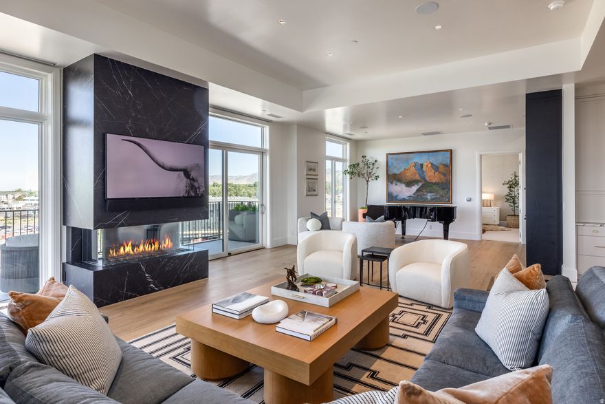 Penthouse #508 is located in The Grandeur - a highly secure building with unmatched amenities - this Custom built Penthouse is ideal for those seeking a simplified lifestyle or looking to downsize without sacrificing quality, comfort, or location. Masterfully designed by Carrie Oliver with Co & Co Curated, where every element reflects a perfect harmony of luxury and livability. Thoughtfully crafted with an eye for detail, this penthouse offers an elevated lifestyle experience that seamlessly blends comfort with sophistication.    Key Features:  Expansive great room designed for connection, celebration, and effortless entertaining  Gourmet chef's kitchen featuring elegant Neolith porcelain countertops  Heated floors in the spa-inspired primary bathroom  Large Private patios showcasing breathtaking mountain views and the serene Big Cottonwood Creek  Private 2-car garage with additional storage  ensuring convenience, security, and exclusivity.  Nestled within Holladay Hills, a 58-acre, vibrant NEW community offering 750,000 square feet of office, dining, shopping, and entertainment spaces. With scenic walking trails boarding Big Cottonwood Creek, central plazas, and a spacious park perfect for gatherings, this dynamic development brings together everything you need for modern living. Unbeatable panoramic mountain views, 16 miles to Alta / Snowbird resort, convenient proximity to all other Ski resorts, Downtown Salt Lake City, Silicon Slopes, and Salt Lake City International Airport. Come for the luxury. Stay for the lifestyle.