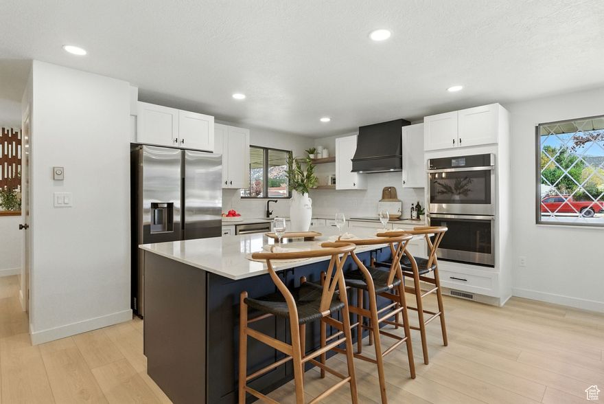 The ONE you've been waiting for!!! Simply put, this home is Quintessenital! The perfect combination of everything you could ask for in a home. Completely remodeled and ready for many more years of memories to be made.  Featuring single level living with an open floor plan that is inviting and welcoming to everyone one who enters. Enjoy the large kitchen with all stainless steel appliances, a built-in microwave, double ovens and induction cooktop. The home features high end finishes such as waterproof LVP flooring, Granite, Quartz, and Quartzite countertops. There are two large family rooms on the main floor of which BOTH have a wood burning fireplace. The primary suite offers a custom built in wardrobe, a large shower, and double sink vanity that is well lit for anyone getting ready in the mornings. The main floor offers 2 bedrooms, 3 beautiful bathrooms, and laundry. Downstairs you will find 3 more bedrooms and a bathroom that features a huge 9 foot double sink vanity and 5 and a half foot deep soaker tub. There is a second full kitchen with stainless steel appliances, family room, laundry, wood burniing fireplace, and separate entrance. The home also features central heating and air through out. This home sits on a beautiful .35 acre corner lot in the most desireable area of Nephi. WIth 50 year old mature trees, a beautfully landscaped yard, and large covered patio, you'll find yourself enjoying the outside of the home almost as much as the inside. With spectacular views of Mt. Nebo and the ability to hop on your ATV and ride off the driveway straight to the mountains, this home really has it ALL!