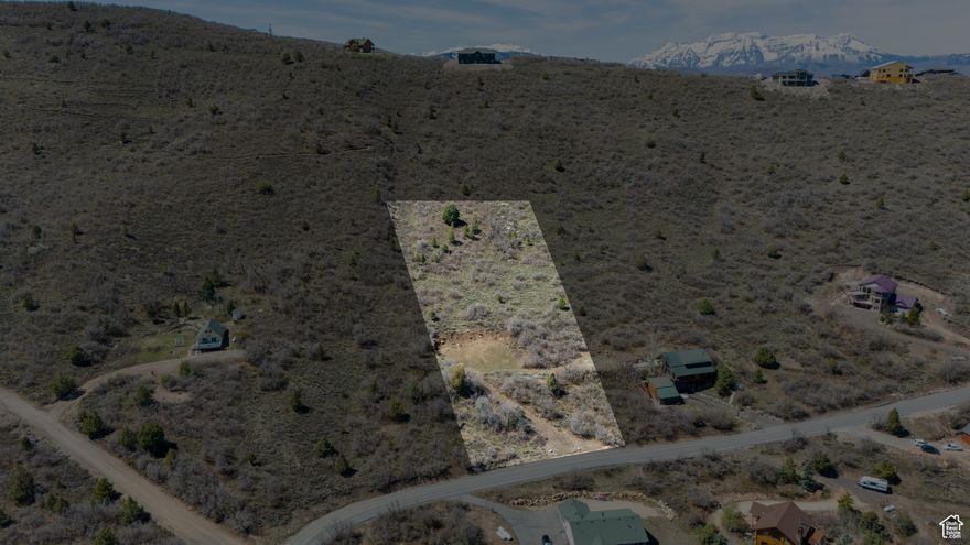 Beautiful 2-acre lot in Timber Lakes with incredible mountain and valley views. Seller financing available with terms as little as 0% down and 3.25% interest. Perc tested and ready to build with house pad and driveway cleared. Year-round access in a gated community just minutes from Heber City.