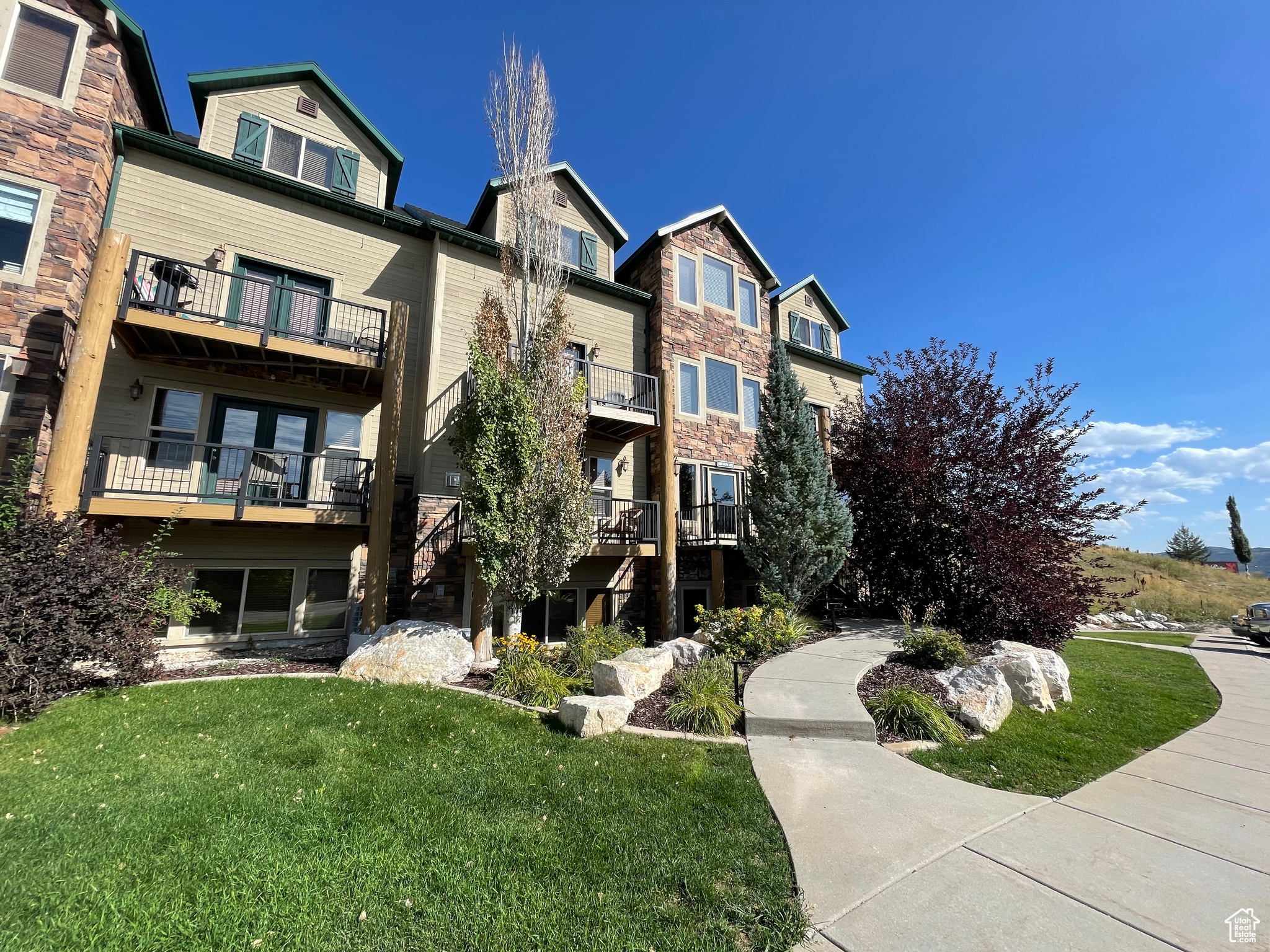 This beautifully maintained 3-bedroom, 3-bath condo has been thoughtfully updated with new LVP flooring throughout and soon to have sleek quartz countertops-making it truly stand out. The main level features two full kitchens, two full baths, a stackable washer/dryer, and a spacious primary suite that can also serve as a second living area within the lock-out suite. With its own entrance, the lock-out suite is perfect for hosting multiple groups, offering both privacy and exceptional rental potential. Upstairs, you'll find two generously sized bedrooms with breathtaking views, a shared full bath with dual access, and a second laundry area. Sold fully furnished and completely turn-key, this condo is ready to enjoy as a primary residence, second home, or investment property. Zoned for nightly rentals, it offers outstanding income opportunities. Perfectly situated next to Wolf Creek's 18-hole golf course and just steps from the Powder Mountain shuttle stop, and 18 minutes from Snowbasin ski resort (host of the 2034 Olympics) , the location can't be beat! Residents also enjoy access to the outdoor pool, two jacuzzis, sauna, and endless hiking and biking trails. With Pineview Reservoir, two world class ski resorts, dining, and more recreation just minutes away, this condo delivers the best of Ogden Valley living. Don't miss the chance to own this rare, high-performing, and impeccably maintained property!