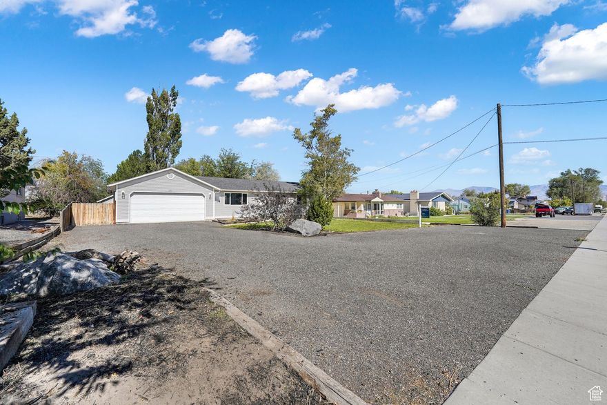 Need space? This property has it. If you have toys, trailers, trucks or a boat to store, this setup is perfect. The oversized garage and tons of parking give you room for everything. Inside you'll find a flexible layout with a full second kitchen, ideal for an in-law suite, multigenerational living or an income option. Enjoy small town living with room for your cars, toys and family. Great house hack potential with a separate rental space or guest suite already set up with its own kitchen. A rare find with this much versatility and parking.