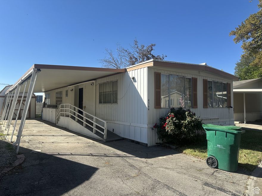 Spacious 2-bedroom, 2-bathroom home in a 55+ active community! At approximately 1,340 sq. ft., this home offers a larger floor plan with plenty of potential. Features include a 2-car tandem carport and ample living space and storage space ready for your personal touch. This is a fixer-upper priced accordingly, offering an affordable opportunity to customize and create your ideal home in a great location. Square footage figures are provided as a courtesy estimate only and were obtained from personal measurements (MagicPlan). Buyer is advised to obtain an independent measurement.