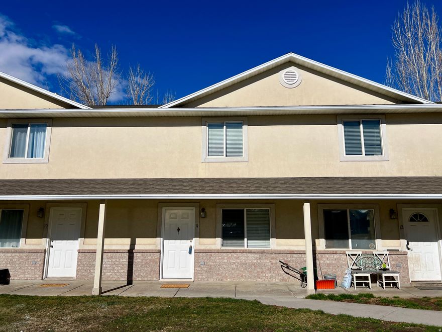 *Offering a flooring allowance to replace the carpeted areas!* Come see this charming 2-bedroom townhome, offering affordable, low-maintenance living. This townhome offers a functional layout, inviting living spaces, and beautiful mountain views. Perfect for first-time buyers, investors, or anyone seeking comfort in a peaceful setting.