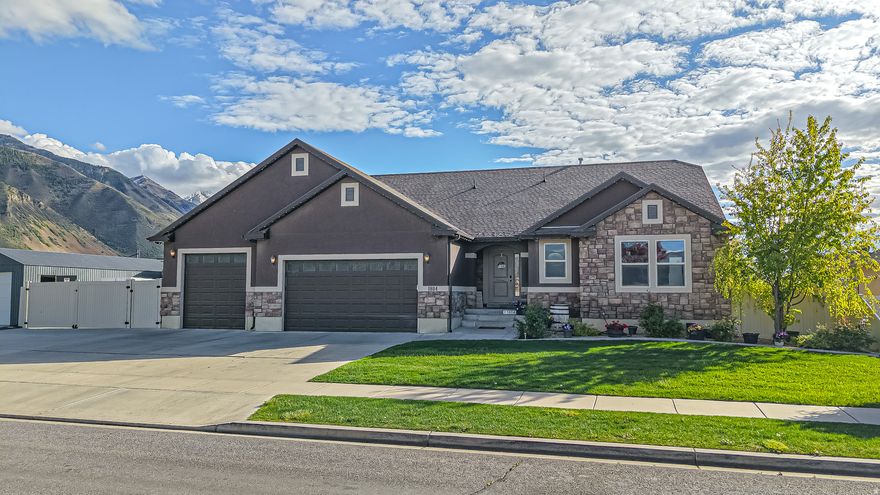Be sure to check out the tours! Located in a highly desirable East Spanish Fork neighborhood, this well-maintained home offers the perfect blend of functionality, efficiency, and income potential. Just minutes from local walking trails and the golf course, the location alone is hard to beat. Inside, the main level features thoughtful upgrades throughout, including a spacious primary suite with double vanities and dual shower heads. The kitchen and laundry areas are finished with granite countertops, and bathrooms include tile surrounds for a clean, updated feel. The fully finished basement includes 9-foot ceilings and a separate 3 bed, 1 bath apartment with its own walk-out entrance-ideal for rental income or multi-generational living. The basement also features a full tub and shower, stackable washer and dryer, refrigerator, and a washout sink that can double as a salon setup or is stubbed for a future dishwasher. The dining area in the basement apartment is currently being used as a salon, offering additional flexibility for in-home business use or easy conversion back to dining space. Energy efficiency is a major bonus with fully owned solar installed in 2021, paired with a Sonnen 12.5 kWh battery system for added reliability and savings. Outside, enjoy a fully fenced backyard, a 12x30 insulated shop, and a spacious 3-car garage with ample storage. The garage is also equipped with sink hookups and gas stubbed for both a heater and patio BBQ.Additional features include a security system for added peace of mind. This home checks all the boxes-space, upgrades, efficiency, and versatility in a prime location.
