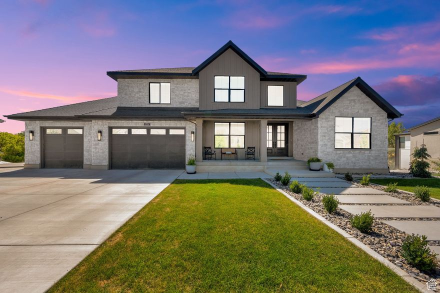 Experience luxury living in Draper's coveted Big Willow neighborhood. Set on a private .41-acre lot with no backyard neighbors, this 6,971 sq ft home blends elegance and comfort with direct trail access right out your gate.  Inside, soaring ceilings and tri-fold glass doors create an open, light-filled flow. The main floor boasts a chef's kitchen, formal dining, office, library, and a primary suite with spa-like bath and walk-in closet. Upstairs offers three bedrooms, two baths, and a spacious family room, while the unfinished walkout basement with 10' ceilings is ready for your vision.  Outside, enjoy a newly landscaped yard, RV parking, and an expanded 4-car garage.