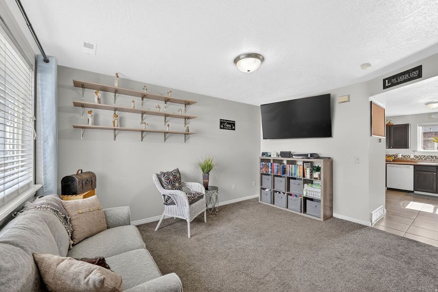 Come home to an open-stairway living space, a well-sized kitchen with a new dishwasher, and a convenient half bath on the main level. Enjoy the back patio that opens up to a large common area yard along the fence, perfect for outdoor relaxation. Upstairs, you will find two spacious bedrooms, a full bath, and laundry on the same level for added convenience. This location is ideally situated in a peaceful North Ogden neighborhood close to shopping, restaurants, public transportation, and various local amenities. Please contact me to schedule your showing today before this opportunity to make it your own is gone. Square footage figures are provided as a courtesy estimate only and were obtained from county records. The buyer is advised to obtain an independent measurement.