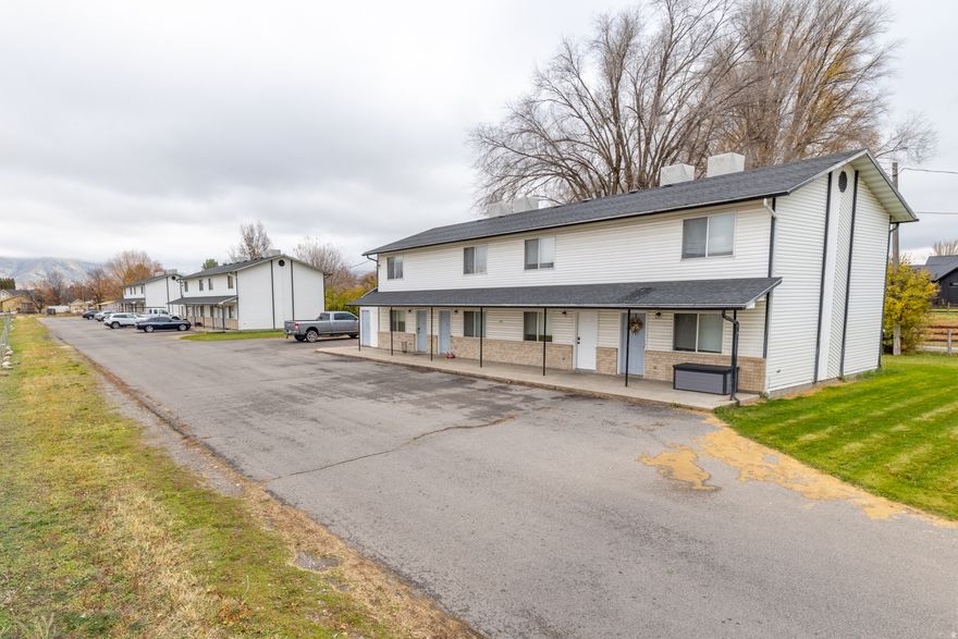 Incredible investment opportunity in Hyrum! This deal includes three 4-plexes (12 units total) that are currently fully leased, providing immediate income.  The property sits on a massive 2.5-acre lot featuring a large horse pasture. HUGE UPSIDE: The lot size meets the criteria for a Planned Unit Development (PUD), giving the new owner the potential to build additional units and maximize the investment.  12 Units (3 Buildings)  Fully Leased  2.5 Acres  Zoning/Land Use: Meets PUD minimums for expansion.  Perfect for the investor looking for stability today and growth tomorrow. Buyer to verify all development potential with Hyrum City. Financials available upon request.