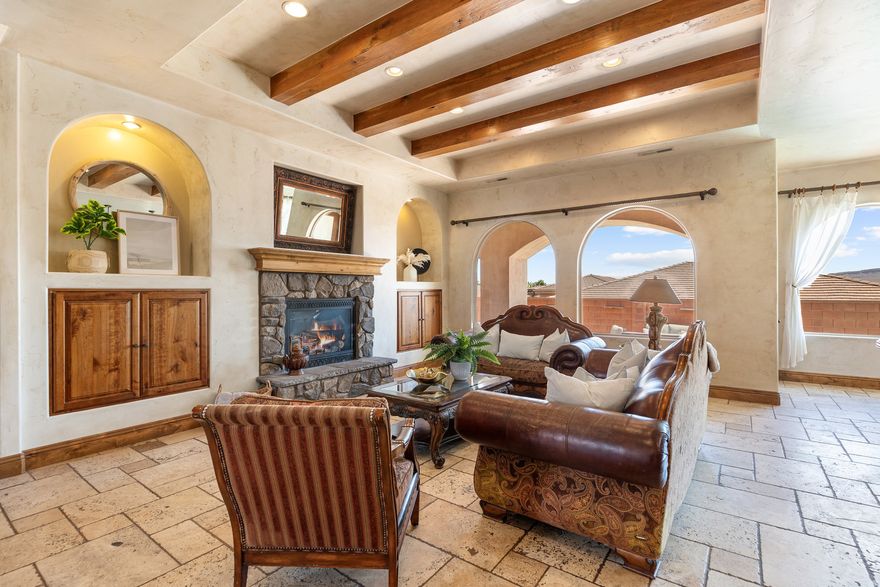 Incredible opportunity to own a home that the bank has appraised for almost $2m in beautiful Ivins. Your perfect Tuscany retreat in the heart of Ivins awaits! This home truly has it all - from the sparkling pool and private courtyard with gorgeous views, to the oversized 4-car garage that fits all your gear. The home features a remarkable multi-level layout perfect for entertaining and creating memories with family and friends. At the entrance, you are welcome by the serene sounds of the water feature in the large courtyard. Once you walk through the large arch glass wooden doors, you will experience a large open floor concept that includes the large upstairs living room, kitchen, and dining area with large mountain view windows. The home features 5,544 SqFt (2,772 in each floor), 6 bedrooms, 6 bathrooms, theater room, 2x flex rooms, Office/Den, large storage room, granite honed edge countertops throughout, and wood beam living room ceilings. Inside, the kitchen is a chef's delight with large multi-tier island, a built-in fridge, and a hidden pantry big enough for all your needs, knotty alder cabinets, 6 burner chef freestanding stove, and built-in swivel island chairs. The spacious primary bedroom is a relaxing escape, complete with its own secluded flex room, a custom built-in closet, a spa-like bath with a triple-head shower, separate soaking tub, and large sauna room. The finished basement has a large 2nd living room that is perfect for a game room. Movie nights? This home has you covered, thanks to your very own theater room. You'll also love the large mudroom, laundry space, kitchenette, and a den perfect for work or hobbies. The outdoor space is a wonderful entertainment space with Outside, fire up the built-in barbecue and fridge under the covered patio, and enjoy effortless entertaining.   The home is near the Greater Saint George paved bike/walking trail system with over 50 miles that connects you across the city, including the iconic Snow Canyon State Park, Sullivan Soccer Park, and miles of beautiful Red Rock terrain. Minutes from amenities in downtown Saint George, such as over 16 golf courses including Black Desert Golf Course home to the Fall 2024 PGA TOUR's FedEx Cup, hiking and cycling trails, and a short drive to some of America's most awe-inspiring places; National parks Zion, Bryce and the north rim of the Grand Canyon, and state parks like Sand Hollow Reservoir, Gunlock Reservoir, Quail Creek Reservoir, and nearby Dixie National Forest. The City of Ivins is known for its low light pollution initiative to protect its night sky and for its breathtaking views of Red Mountain. There is no doubt that the word is out that at 2,700 feet above sea level, on the edge of the Mojave desert, Colorado Plateau, and the Great Basin, lies one of America's most beautiful and distinctively geological places, Saint George! No other place says that you have arrived than this beautiful home.  All information herein is deemed reliable but is not guaranteed. The buyer is responsible to verify all listing information, including square feet/acreage, to the buyer's own satisfaction.