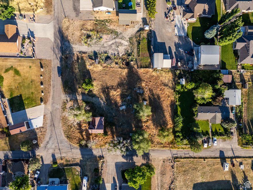 Duplex Development Opportunity | 0.43 Acres with Mountain Views  East-facing 0.43-acre lot in Mt. Pleasant, zoned for multifamily residential use - ideal for a duplex or other small-scale development. Situated in a quiet, established neighborhood with sweeping mountain vistas and walkable access to the town center. Includes " irrigation water right. Square footage figures are provided as courtesy estimates only and were obtained from county records. Buyer is advised to obtain an independent measurement.