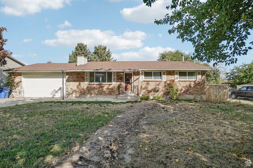 Opportunity knocks! This spacious 2,268 sq ft West Valley home on a 0.19-acre lot is priced to sell below market value. Featuring a deep 2-car garage, covered patio, fireplace, and master suite, it's packed with potential. Updates include new main water line (2025) and water heater (2019). New carpet in the basement, plus 2 storage sheds, a greenhouse, and all appliances included. Perfect for a first-time buyer, investor, or anyone looking to add their own touch. Solid home, great area-bring your vision!