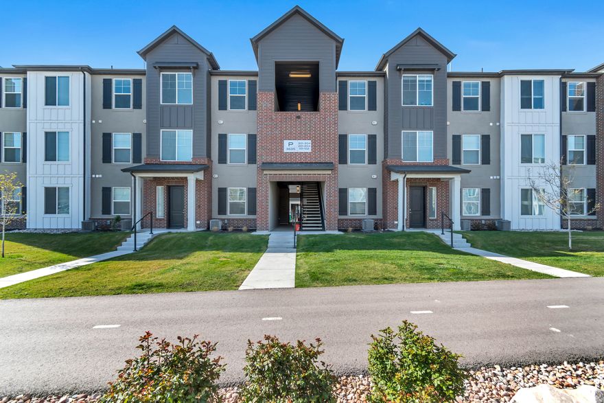 Welcome to your move-in-ready sanctuary in the heart of Lehi. Built in 2022, this stunning top-level condo in the Gardner project offers 1,349 square feet of modern, open-concept living. As you step inside, you are greeted by expansive vaulted ceilings and high-end finishes, including sleek quartz countertops and durable laminate flooring that flow seamlessly through the main living areas. The thoughtfully designed layout features three spacious bedrooms and two bathrooms, highlighted by a private primary suite complete with a generous walk-in closet. Perfectly situated to capture breathtaking mountain and valley views, this home also comes equipped with wired Ethernet ports to keep you connected in the center of Silicon Slopes.  Life at Gardner is as convenient as it is comfortable. Your monthly HOA fee takes the stress out of homeownership by covering water, sewer, trash, and snow removal, while providing access to premium community amenities. Spend your summers lounging by the pool, stay active in the fully equipped gym and clubhouse, or enjoy the on-site playground and park. This property includes an attached one-car garage with additional driveway parking and is ideally located within the Alpine School District, just minutes from world-class shopping and dining.  Square footage figures are provided as a courtesy estimate only and were obtained from County Records.  Buyer is advised to obtain an independent measurement. Buyer and agent to verify all information.