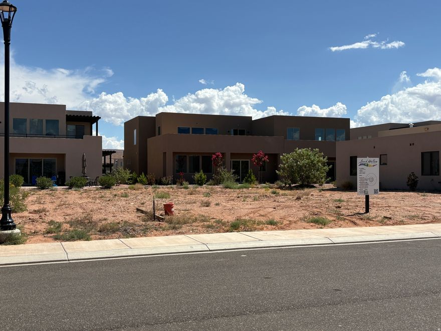 Live Elevated at The Retreat at Sand Hollow Resort. Discover refined desert living with this 0.16-acre pad-ready homesite in Southern Utah's premier golf community. This lot combines luxury, convenience, and breathtaking red rock views--all within a nationally ranked championship golf resort. Highlights:  Water connection fees already paid--saving you time and money  Permit-ready, HOA-approved building plans available for purchase  Space for a private pool and resort-style outdoor living  Just 15 minutes from the regional airport and under 2 hours from Las Vegas  Easy access to golf, sand dunes, boating, hiking, and more. Don't love the existing plans? Collaborate with our Approved Builder to design a custom home that fits your vision.