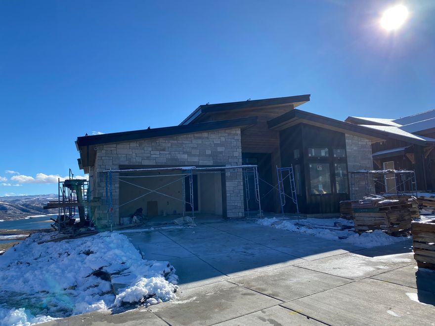 Explore Amanti Lago, an exceptional new community near Park City, offering a limited collection of just 28 homesites.Positioned above the peaceful Jordanelle Reservoir, enjoy breathtaking views of Deer Valley's ski slopes. Immerse yourself in the tranquility of nature through nearby walking and biking trails, and savor year-round recreation, from skiing to boating to golfing. Ski Shuttle service to the Deer Valley East Gondola included. The Sophia Home Plan provides main floor living at its finest. Impressive entry with great room providing 14 ft. ceiling, soaring windows, and generous entertaining space. The primary suite offers views of the mountains and lake with a spacious spa like bathroom. The main floor includes a second bedroom or home office. Bring the outdoors in with the multi slide glass door to the covered deck. Gorgeous staircase is open to the walk out lower level with family room, 2 additional beds and baths and even more outdoor space. Please see selections attached to listing. Home is under construction with estimated completion in February 2026. Photos are of a previously built model home. Colors and finishes to vary.  Ask agent about current incentive.