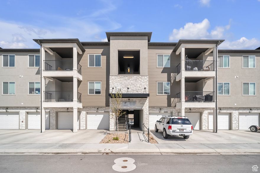 Mountain Ridge in Riverton - a beautiful, friendly community where everything is just minutes away: schools, parks, shopping, and outdoor recreation. This top-floor condo offers 3 spacious bedrooms, 2 full bathrooms, and modern open-concept living filled with natural light. Built in 2023, it feels fresh and stylish, from the kitchen design to every bright corner. Enjoy your private balcony for relaxing or fresh air breaks. Washer, dryer, and refrigerator are included. You'll have your own private garage plus extra parking. Community amenities include a clubhouse, swimming pool, and scenic walking/biking trails. With an affordable HOA and an amazing price, this condo is a fantastic opportunity. Contact us today for a private showing!