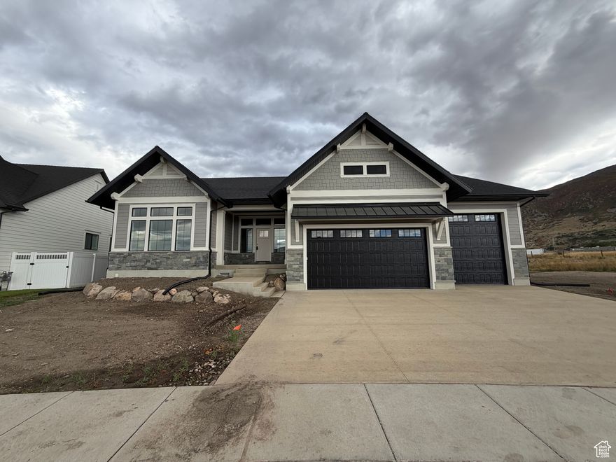 Builder Incentive: **Up to $20,000 in Preferred Lender Credit toward closing costs or a rate buy down.**  Welcome to your dream home -- a newly listed, impeccably crafted house nestled in the charming community of Farmington. This stunning residence boasts a generous living space of 4,797 square feet, featuring four comfortable bedrooms and three luxurious bathrooms. Step inside to discover a home awash with natural light, thanks to the abundant use of large windows throughout. The main level will captivate you with its 10-foot ceilings, complemented by 8-foot doors, creating an open, airy feel. The entryway and kitchen island are emphasized by coffered ceilings adorned with faux beams, providing a touch of elegance. The heart of this home, the gourmet kitchen, is equipped with double ovens, a built-in microwave, and a 36-inch cooktop, perfect for any culinary enthusiast. Whether you're preparing weeknight dinners or hosting a festive gathering, this kitchen meets all your needs. Additionally, there's a full-sized kitchen in the basement and an exquisitely completed theater room for your entertainment needs. Beyond the aesthetics, this home is designed with practicality in mind, featuring a huge pantry with a hidden pantry door, expansive open spaces for gatherings, and a large laundry room. This home is under construction and promises quality and attention to every detail. Located near Farmington High School and within walking distance to Station Park, you'll enjoy easy access to top-notch shopping and dining options. Whether it's running errands or enjoying a day out, everything you need is just a stone's throw away. Experience a blend of comfort and convenience in this meticulously designed home that promises a lifestyle of luxury and ease. Schedule an appointment to see the color selection that have been professionally  picked out for this home. Construction Update: Home is currently being painted. Scheduled be completed 11/5/2025