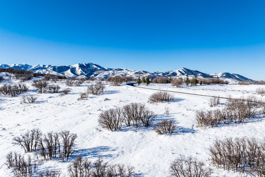 This 13+ acre Ranches at The Preserve lot offers incredible privacy and a gentle downhill slope to build up to four structures with expansive Uinta Mountain range views and adjacent to Glenwild Golf Course & Spa. Set amongst the gamble oak trees, this lot allows an owner to choose the 50,000 sq. ft. building envelope and build a 5,000-17,500 square foot primary residence, a caretaker cottage, a guest house and a barn structure. Horses are permitted with approval from the HOA. Ranches at the Preserve is an exclusive gated residential community in Park City just minutes from the retail and dining options at Kimball Junction, including Whole Foods, minutes to skiing at Park City and Deer Valley resorts, and is located within the Park City School District. Additionally, the community is adjacent to the Glenwild Golf Club & Spa, Utah's #1 rated golf course by Golf Digest Magazine that offers golf, tennis, pickle ball, dining, fitness center, spa social events and more. Memberships are available for purchase separately. The seller has preliminary plans from the award-winning design firm, Lake Flato, which can be shared with a buyer. Build your mountain escape and begin your dream Park City lifestyle! Lot size source is county records, buyer to verify.