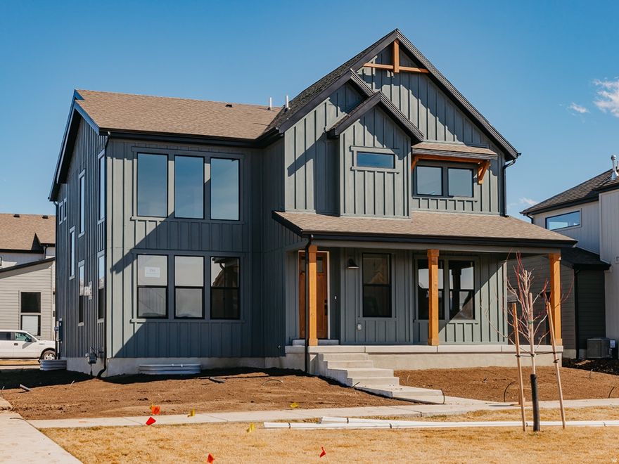 BEST PRICE FOR VALUE IN HEBER*** Welcome to this stunning, fully finished 2-story Ridgeview floor plan located in The Crossings in beautiful Heber, Utah. With 4,005 total square feet and a finished basement, this farmhouse-style home offers incredible space, comfort, and style-plus over $154,000 in premium options already included. Some of the upgrades include a gourmet kitchen with double ovens- High quality quartz countertops- High quality luxury Vinyl plank flooring- stainless steel appliances- 20 ft vaulted ceilings- Gas range cooktop-  Huge windows and closets- Upgraded cabinets- high end lighting package and much more. The gourmet kitchen is a standout, designed for both daily living and entertaining with upgraded finishes, generous workspace, and an easy flow into the main living areas. Outside, you'll love the clean look and convenience of a rear-load garage and park-style yards that add charm and community feel. Full landscaping is included, and yard maintenance is covered, making this home truly low-maintenance and move-in ready. Surrounded by gorgeous mountain views in every direction, The Crossings puts you close to everything Heber Valley is known for-minutes to Park City, nearby parks and trails, and two stunning reservoirs, Deer Creek state park and Jordanelle reservoir. This is a rare opportunity to own a highly upgraded home in an unbeatable neighborhood without paying the park city prices.