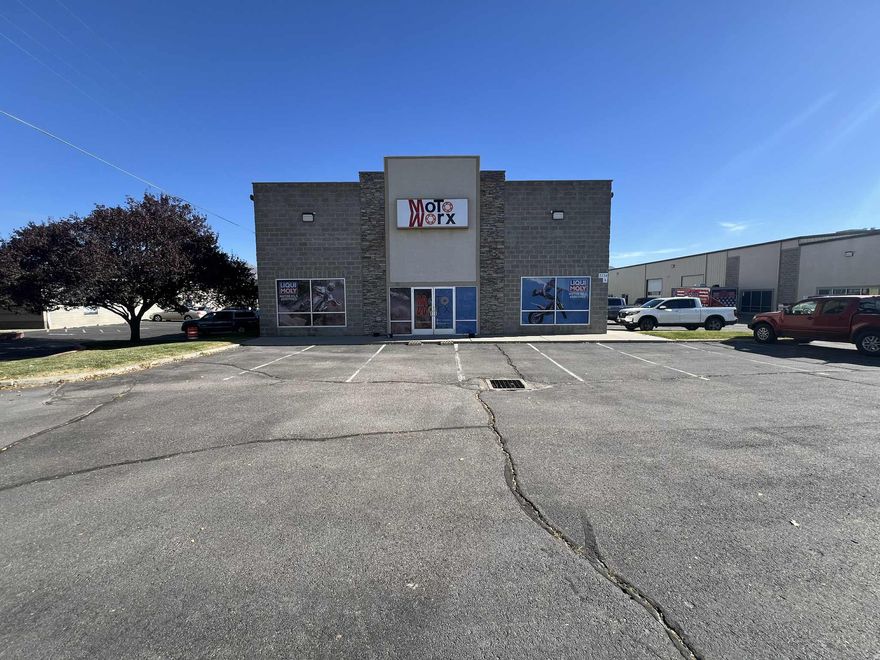 Discover a versatile commercial property in the Ogden Commercial Industrial Park, offering a total of 5,000 SF. The 1,960 SF front showroom boasts dual storefront windows, high ceilings, abundant natural light, and a dedicated private office. The adjoining 3,040 SF warehouse area features impressive 24-foot ceilings and convenient access via a 12' x 14' overhead door, ideal for storage, inventory, or light industrial use. Benefit from excellent visibility and exposure with frontage on the busy 1900 West corridor, along with quick access to the freeway and major roadways. The property is zoned Ogden City OCIP and is located in a HUBZone certified area. Tenant improvements are negotiable to suit your business needs.