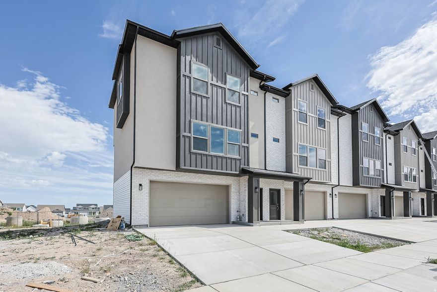 Middle unit, Super Open floorplan that is perfect for gathering. Gorgeous Views!  LVP floors throughout the main floor and in baths. Huge Garage that fits a mega-cab truck and a car. 9' main floor ceilings, Huge pantry, 39" upper cabinets, 7' kitchen island, covered Deck. Come see our Decorated model home.  ~70 days to Finish.  4 units available w/different color packages,  Still time to add upgrades.