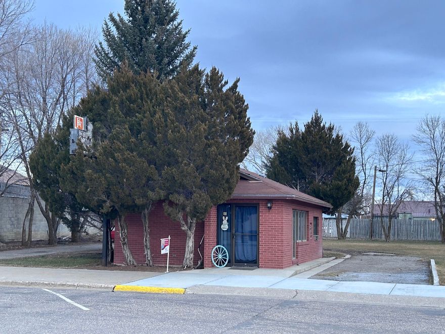 Opportunity is knocking in the heart of Bancroft! This unique 600 sq ft building on .32 acres is perfectly positioned on Main St, and offers incredible commercial/residential potential. Originally built as a bank with drive thru teller service, the building has updates throughout and is full of character. Whether you're looking to start a business, create a live/work space, or expand the existing building, this property offers flexibility and room to grow. There is ample space to add additional living space, build apartments or develop further. Property offers alley access, mature trees and a well established lawn. A rare opportunity to own a versatile property with development potential!