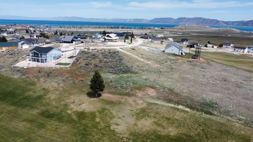 Build your dream home or vacation home on this beautiful lot with panoramic views right on the #1 fairway of the golf course. Close to the Country Club and just minutes away from the boat launch and ATV and snowmobile trails. Short term rentals ARE ALLOWED! You also have the option to purchase Ideal Beach Access which includes private beach access, swimming pools, hot tubs, sauna, green space, activity center, mini golf, tennis and pickle ball courts and more! There's something for everyone at this amazing Bear Lake property!