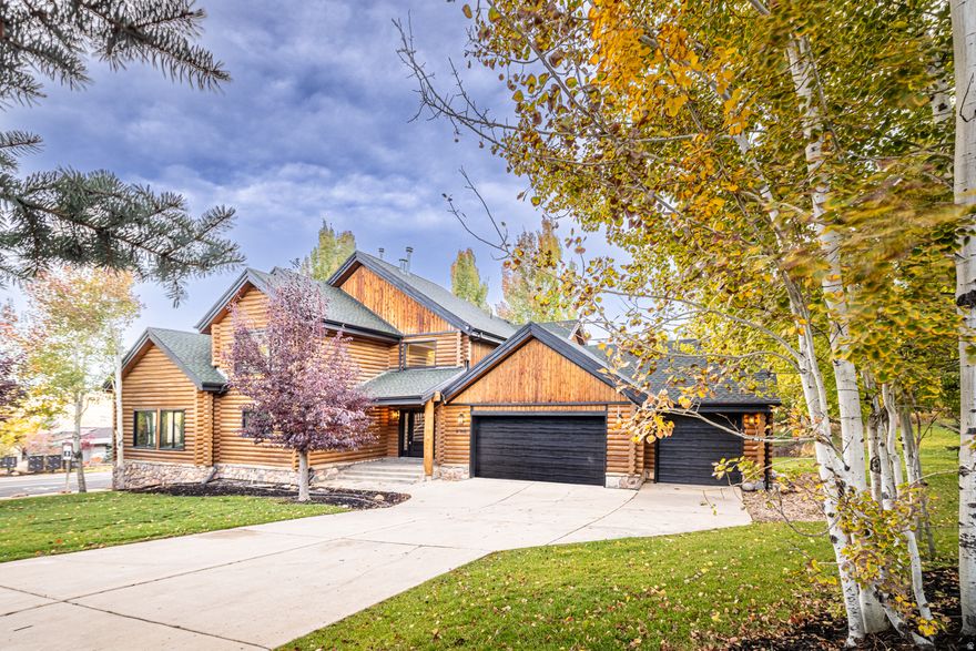 200K PRICE REDUCTION! Perched high atop Jeremy Ranch on a rare corner lot, this fully reimagined 2025 mountain-modern log home blends timeless alpine character with contemporary luxury. Situated in one of Park City's most coveted neighborhoods, the residence captures unobstructed panoramic views of Park City, Canyons, and Deer Valley ski resorts from a serene, private setting at the top of Daybreaker Drive.  A comprehensive 2025 transformation infuses the home with modern comfort and refined design while honoring its log-home heritage. Every detail has been renewed-new windows, designer lighting, premium flooring, fresh interior and exterior paint, and updated electrical throughout-creating a home that feels both sophisticated and welcoming. The vaulted great room showcases signature log-beam craftsmanship and a dramatic stone fireplace framed by sweeping mountain views that fill the space with natural light.  The gourmet kitchen pairs luxurious Calacatta quartz countertops with premium appliances and beautifully refinished cabinetry, offering an elegant yet functional workspace that harmonizes with the home's warm wood tones. Five spacious bedrooms and three and a half designer bathrooms provide comfort for family and guests alike. The main-floor primary suite is a true retreat, featuring a private balcony, spa-inspired bath, and generous closet space.  Downstairs, a large entertainment lounge invites relaxation with a pool table, second fireplace, and space for movie nights or gatherings. The lower level also includes a private Au Pair or in-law apartment with its own entrance-ideal for guests, caretakers, or multigenerational living. A versatile bonus room can serve as a spa, sauna, gym, or additional bedroom depending on your needs.  Outside, the expansive deck and landscaped yard showcase unforgettable sunsets over the Wasatch Range. The enormous three-car garage plus extra guest and camper parking offer exceptional space for vehicles, toys, and gear. Within the Park City School District and minutes from world-class skiing, golf, hiking, and dining, this exceptional log-home retreat embodies the perfect blend of authentic mountain beauty, modern convenience, and timeless design-a rare find in one of Park City's most exclusive settings.