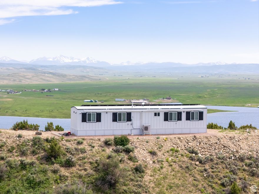 Luxurious Off-Grid Mini Home on 38.67 Acres Overlooking Sulpher Creek Reservoir! Discover a rare opportunity to own a stunning  2-bedroom, 1-bathroom off-grid mini home, blending modern luxury with sustainable living on 38.67 acres of pristine land. Nestled just 15 minutes from Evanston, WY, 20 minutes from the Wasatch National Forest, and a little over an hour from Salt Lake City, this property offers unobstructed 360-degree mountain views and direct access to Sulpher Creek Reservoir. Bordered by BLM land to the East, this retreat ensures privacy and endless recreational possibilities. Property Highlights- Luxurious Interior: The mini home features stainless-steel appliances, a spacious kitchen island, a stackable washer and dryer, and a state-of-the-art hidden TV lift cabinet entertainment system. Advanced Off-Grid Systems: Power: Equipped with a DynamiqTM Wind Turbine with vertical scoops, generating power in winds as low as 3.8 mph, paired with four 48V LiFePO4 batteries providing 40 kW of storage. A Cummins 20kW LPG generator with ATS ensures backup power. Solar: Eight JINKO JKM405M-72HL-V 405W solar panels. Dual Sol-Ark 12kW Wi-Fi inverters power the home and offer 50-amp service for RVs or additional mini-houses. Water: An 80-ft well delivers pristine water (lab report available, pH 6.93) with an on-demand water heater and hard water removal system. Utilities: Propane for heating and appliances, and a septic system for waste management. Climate Control: Wi-Fi-enabled mini-split heating and cooling with remote climate control and system monitoring. Connectivity: Starlink internet for high-speed access in this remote paradise. Whole-house audio system.Energy Efficiency: Insulated with R-30 expanding foam for superior thermal performance. Storage: Includes an 8x50 box trailer, providing ample space for equipment, tools, or recreational gear. Access & Location: Includes a 30-year BLM right-of-way (approximately 27 years remaining) for secure access. Enjoy proximity to Sulpher Creek Reservoir, perfect for outdoor enthusiasts. Lifestyle & Location- This property is a haven for those seeking a luxurious, self-sufficient lifestyle surrounded by nature. Whether you're seeking a private retreat, a vacation home, or an off-grid investment, this mini home offers unparalleled quality and serenity. Explore the nearby Wasatch National Forest, fish or boat at Sulpher Creek Reservoir, or enjoy the convenience of Evanston just minutes away. Terms- Cash Only. Buyer and buyer's agent to verify all information.