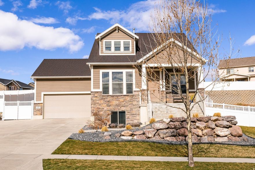 Beautifully upgraded home in the highly sought-after East Layton Greyhawk neighborhood! Situated on a premium corner lot, this home was thoughtfully positioned to capture stunning mountain views from every level-including the basement-while maximizing natural light through strategically placed windows.  Ideally located just 33 minutes to the Salt Lake City International Airport, 15 minutes to Farmington Station, and only 5 minutes to Hill Air Force Base. Enjoy convenient access to shopping, schools, I-15, Highway 89, the Greyhawk community park, and nearby walking trails.  The open-concept floor plan is perfect for both everyday living and entertaining. A cozy gas fireplace paired with breathtaking mountain views creates a warm and inviting living space. The chef's kitchen features upgraded maple cabinetry, rollout shelves in all lower cabinets, custom drawer dividers in the island, and a convenient slide-out shelf beside the refrigerator.  Designed for true single-level living, the main floor includes a spacious primary suite with en suite bathroom, walk-in closet, and nearby laundry. All bedrooms feature large walk-in closets, and the home boasts 9-foot ceilings throughout, enhancing the sense of space and light.  Additional highlights include ample parking with an RV pad, an oversized garage with extra storage, and a fully fenced yard. The beautifully landscaped backyard offers garden boxes, a full drip irrigation system, and a perfect setting for relaxing or entertaining. Enjoy peaceful evenings on the covered front patio.  Meticulously maintained and truly move-in ready-this home is a must-see!