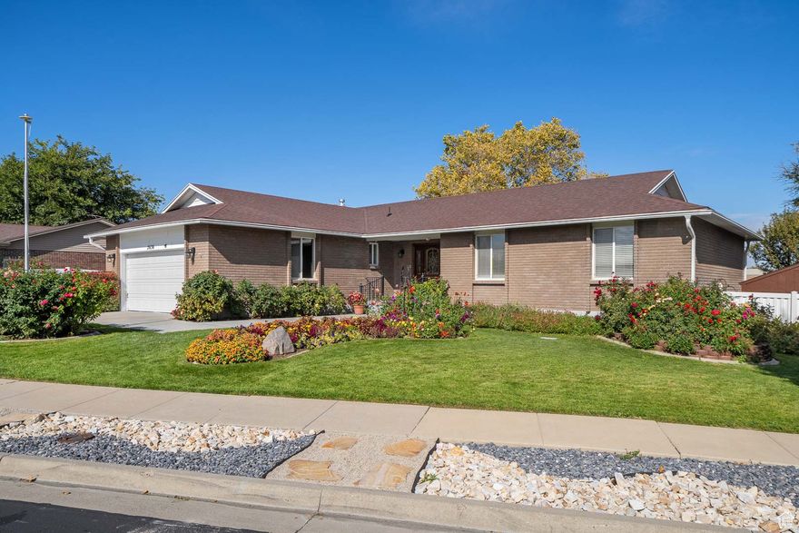 Charming West Jordan Home on Half Acre! Enjoy quiet living in this 4-bedroom, 3-bath home with fresh paint and new carpet throughout. The spacious .5-acre lot features multiple sheds, a large covered metal carport perfect for RVs or boats, and plenty of room for all your toys. Relax in the big backyard surrounded by fruit trees and a garden area-ideal for family gatherings. Located in a peaceful neighborhood with plenty of space to stretch out! Schedule your showing today.