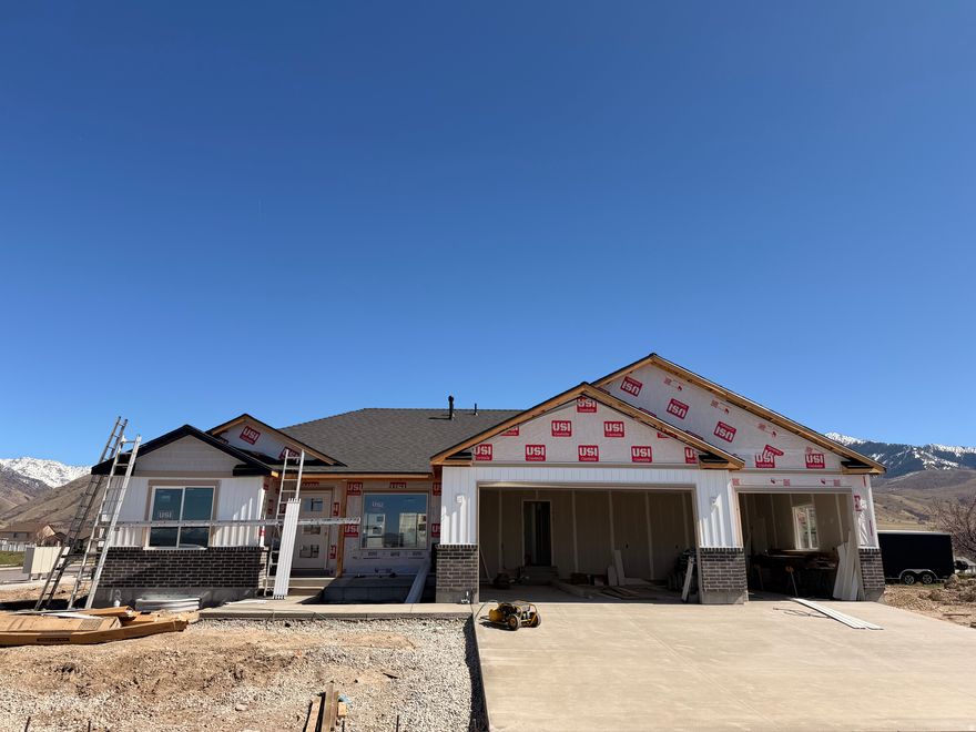 Welcome to your dream home, perfectly situated on the highly sought-after East Bench! This Stunning-new "Ridge" floor plan blends modern luxury with everyday functionality-and offers breathtaking west-facing sunset views you'll enjoy every evening.  Inside you will enjoy the spacious open Concept Layout  Designed for seamless flow, entertaining, and comfortable living. The Chef's Kitchen with TWO Walk-In Pantries  A rare and highly desirable feature, offering abundant storage and organization.Elegant Finishes Throughout  High ceilings, large windows, and premium materials. Luxurious Primary Suite  A private retreat with spa-inspired bathroom and generous closet space Don't miss your chance to own a brand-new home in one of the most desirable areas on the East Bench. Home should be complete by end of April.Contact us today to schedule your private showing!