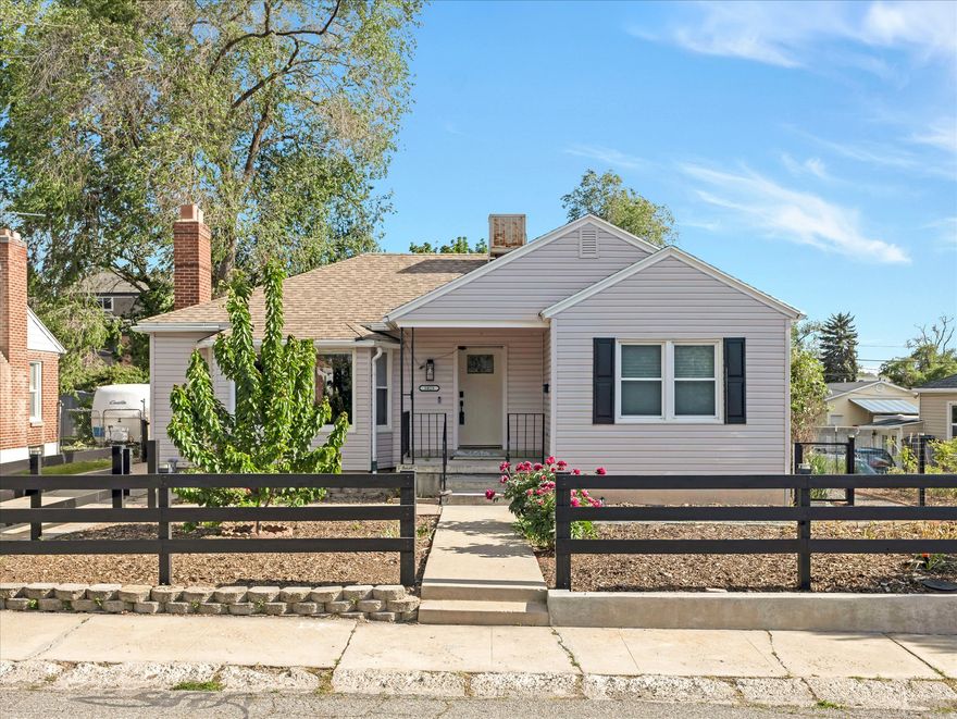 Don't miss this stunning, fully updated home in the heart of highly sought after Millcreek. Ideally located within walking distance of Millcreek Commons, where you can enjoy year round community events including skating, concerts, farmers markets, shopping, dining, and more. Centrally located near schools, parks, and shopping, with quick access to I-215 for an easy commute anywhere in the valley or fast access to world class skiing, hiking, biking, climbing, and outdoor recreation in the nearby canyons. From the moment you arrive, you'll appreciate the exceptional curb appeal with clean modern siding, striking black trim, and thoughtfully designed water wise landscaping that helps conserve resources while reducing utility costs. Fully paid off solar panels provide additional energy savings and environmentally conscious living. Step inside to an inviting open concept main living area featuring beautiful flooring, abundant natural light, and a beautiful cozy fireplace. The updated kitchen showcases stylish gray cabinetry, crisp white granite countertops, recessed lighting, a large single-basin sink, and sleek black appliances, including a premium gas range with upgraded ventilation system. The spacious breakfast bar and separate dining area with designer chandelier create the perfect setup for both everyday living and entertaining. The main level also offers two spacious bedrooms with upgraded split blackout blinds and a beautifully updated full bathroom with modern finishes. Downstairs, you'll find a comfortable family room perfect for movie nights, games, or relaxing, along with three additional spacious bedrooms, another stylishly updated full bathroom, a large laundry area, and ample storage space. The backyard has been thoughtfully designed to balance comfort, functionality, and sustainability. Enjoy relaxing or entertaining on the fully covered patio while taking advantage of five young fruit trees that are already bearing fruit; including Bing cherry, Asian pear, yellow peach, pluot, and Rainier cherry and a newly installed sprinkler system for easy maintenance. The extra long driveway can fit three cars and the detached two car garage provides plenty of parking and additional storage space. This home is truly move in ready with extensive upgrades already completed, including newer furnace, A/C, water heater, roof, windows, and appliances. Additional health and safety improvements include a whole house humidifier system, radon mitigation system, and full asbestos mitigation. Combined with the water wise landscaping and fully paid off solar panels, this home offers comfort, efficiency, peace of mind, and long term savings all in one exceptional package.