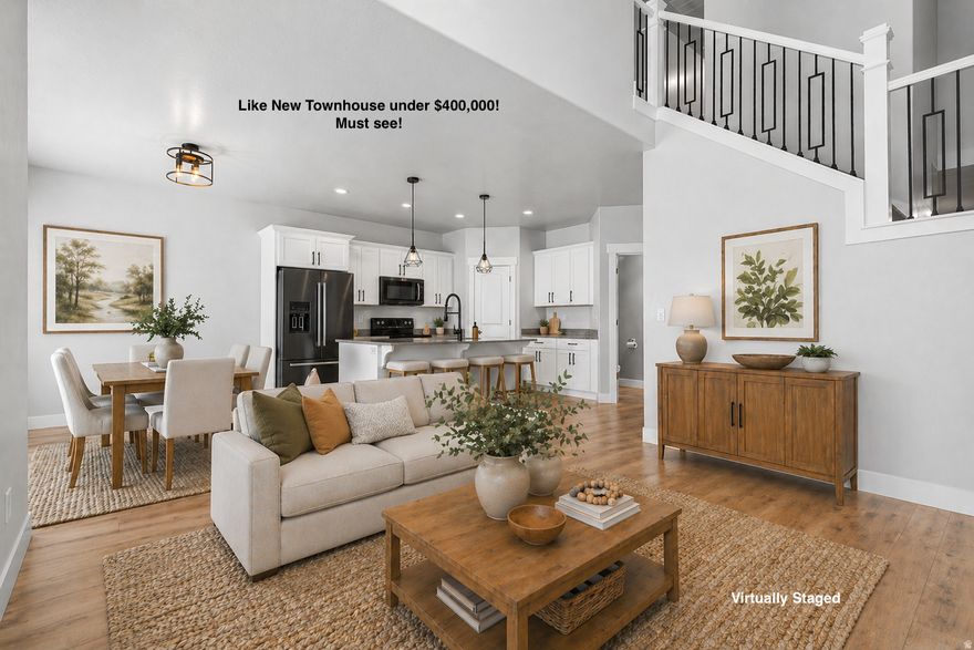 The only townhouse in Saratoga Springs under $400K with this square footage and a 2020 build! Shows like new! Welcome to this beautiful home in the desirable Quailhill community within Mt. Saratoga. This quiet neighborhood offers fantastic amenities, including a pool, clubhouse, and nearby parks.Thoughtfully upgraded throughout, the home features timeless finishes such as plantation shutters, quartz countertops, new carpet, a brand new dishwasher, and a water softener, along with views overlooking the pool. The 2nd story high ceilings in the family room invite an abundance of natural light, creating a bright and welcoming space. Enjoy a small, fenced backyard, perfect for summer BBQs or a little extra space for your pet. Conveniently located just minutes from the newly extended Mountain View Corridor. Priced to move! Square footage figures are provided as a courtesy estimate only and were obtained from county records.  Buyer is advised to obtain an independent measurement.