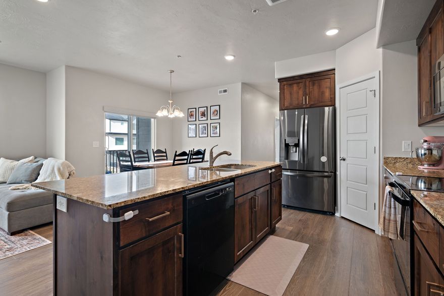 Seller offering 1% toward buyer closing costs when using the seller's preferred lender! Beautiful like - new condo built in 2021 offering modern design, low maintenance living, and one of the best values in American Fork.   This 3-bedroom, 2-bath home offers comfortable living and a bright open-concept layout that makes everyday living and entertaining easy.  The spacious kitchen flows seamlessly into the living and dining areas and features modern finishes and plenty of space to gather. The private primary suite includes an en-suite bathroom and walk-in closet, while two additional bedrooms offer flexibility for guests, a home office, or family living.  This home offers the feel of new construction without the higher price, making it one of the best values in the area.  Enjoy low-maintenance living with HOA amenities that include a pool, parks, walking paths, water, sewer, trash, and snow removal.  Located just minutes from I-15, shopping, dining, parks, and outdoor recreation, this home offers unbeatable convenience while still feeling tucked into a quiet community.  Move-in ready, thoughtfully designed, and priced to compete-this is one you don't want to miss.