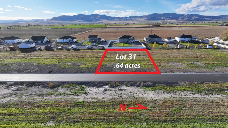 Bring your own builder on this .64-acre flat lot located in an area of large country parcels with animal rights.  Enjoy beautiful Wasatch Mountain views and open surroundings that offer both privacy and a true rural feel.  This property includes a West Corinne Culinary Water Share valued at $34,000, adding value and peace of mind. Natural gas and electric are available at the lot line, simplifying future development, and fire hydrant coverage is already in place for added safety. A rare opportunity to own a scenic homesite with space for animals, mountain views, and essential utilities nearby-all in a desirable country setting.