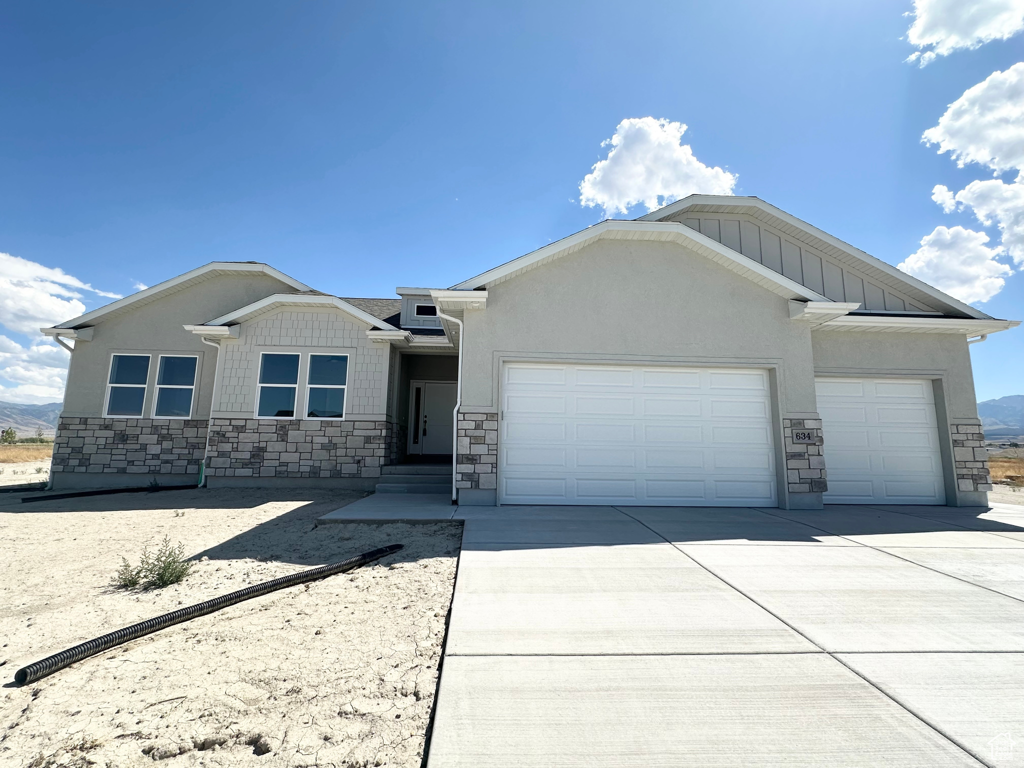 Beautiful home on a half acre lot awaiting you and includes a water share! It is in a new beautiful community, schools and shopping close by, easy access to the freeway, and recreation. Quality home built with 2x6 exterior framing, extra insulation, quality windows allow this home to have maximize on energy use. Great master suite, wonderful floor plan, 240 SF covered patio to enjoy the evening mountain views. On demand water heater, water softener, gas fireplace....some nice bells and whistles to come home to! Samuel Clegg Signature Homes, check it out today.